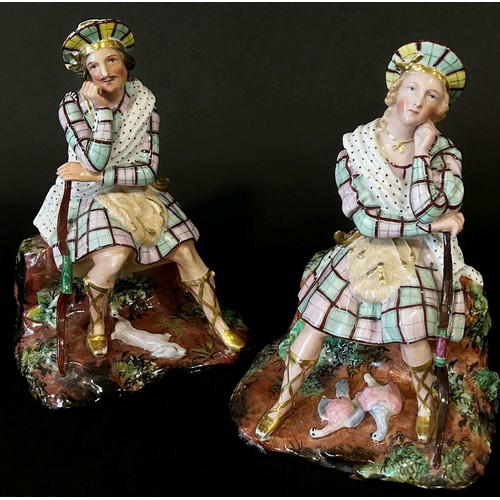 127 - A pair of 19th century French Paris porcelain Scottish Highlander figural flasks, in the form of sea... 