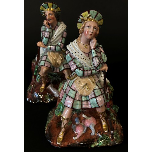 127 - A pair of 19th century French Paris porcelain Scottish Highlander figural flasks, in the form of sea... 