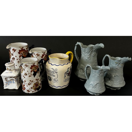 20 - A large mixed collection of 19th century and later porcelain and stoneware jugs of varying design, t... 