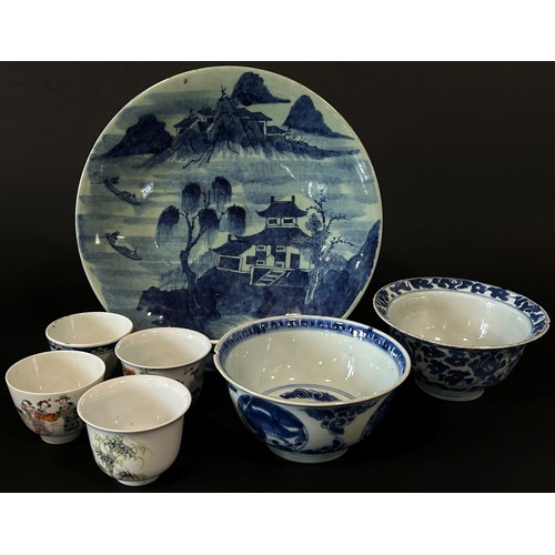 49 - A mixed collection of Chinese export porcelain to include a large celadon ground charger decorated w... 