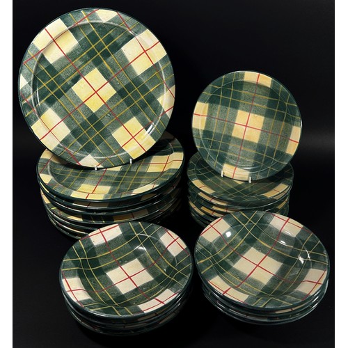 124 - A quantity of decorative tartan pattern stoneware dinner wares to include plates, storage jars, etc