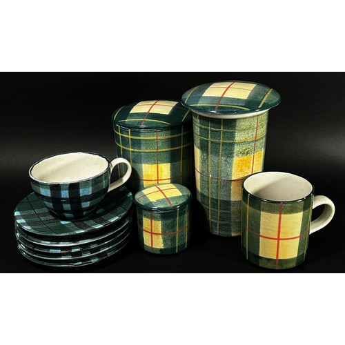 124 - A quantity of decorative tartan pattern stoneware dinner wares to include plates, storage jars, etc