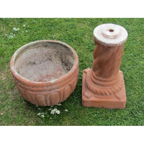 1204 - A weathered contemporary terracotta planter with circular bowl raised on a cylindrical pedestal and ... 