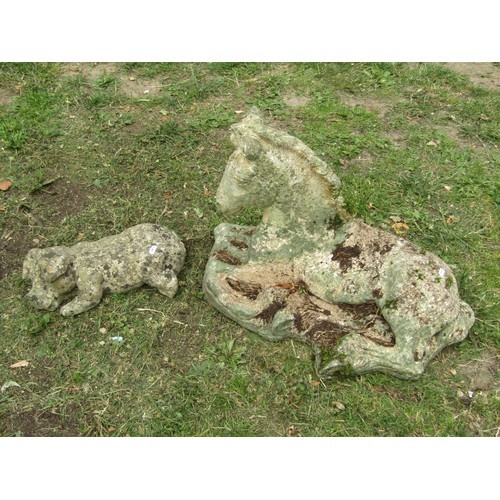 1205 - A weathered cast composition stone garden ornament in the form of a recumbent horse/foal 42 cm high ... 