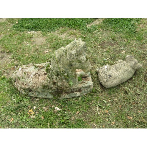 1205 - A weathered cast composition stone garden ornament in the form of a recumbent horse/foal 42 cm high ... 