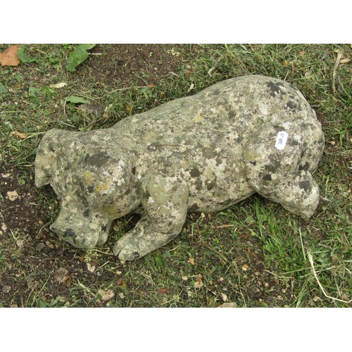 1205 - A weathered cast composition stone garden ornament in the form of a recumbent horse/foal 42 cm high ... 