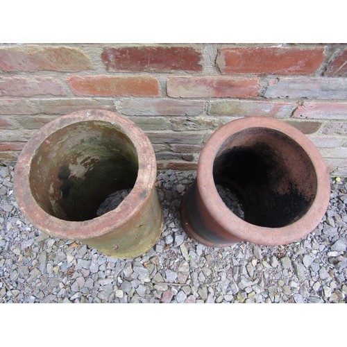 1207 - Two similar weathered chimney pots of cylindrical tapered form (af) 60 cm high