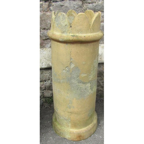 1209 - A weathered buff coloured cylindrical crown top chimney pot 74 cm high together with a weathered ter... 