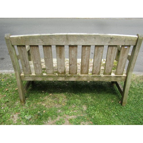 1211 - A weathered soft wood two seat garden bench with slatted seat and back, 130 cm long