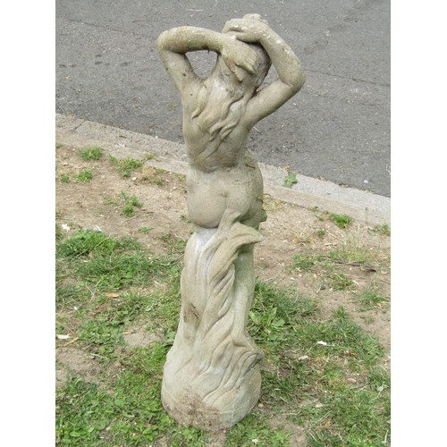 1213 - A weathered cast composition stone garden ornament in the form of a scantily clad  maiden 87 cm high