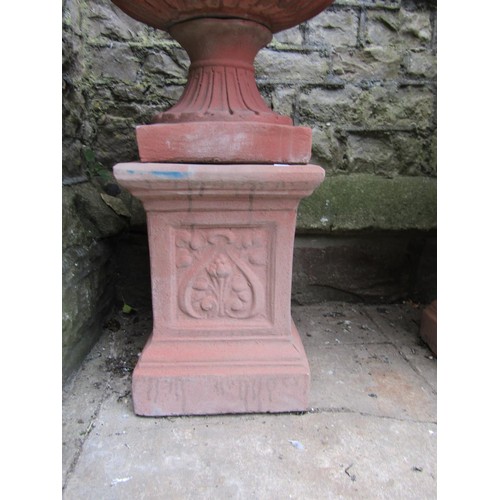 1215 - A pair of cast composition stone classical design faux terracotta garden urns, the squat circular lo... 