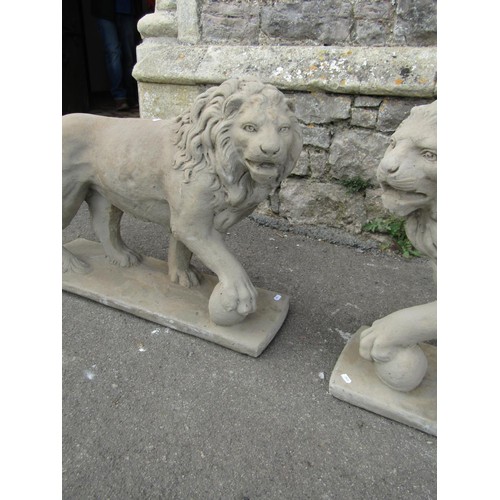 1216 - A pair of cast composition stone garden terrace/pier ornaments in the form of standing lions 55 cm h... 