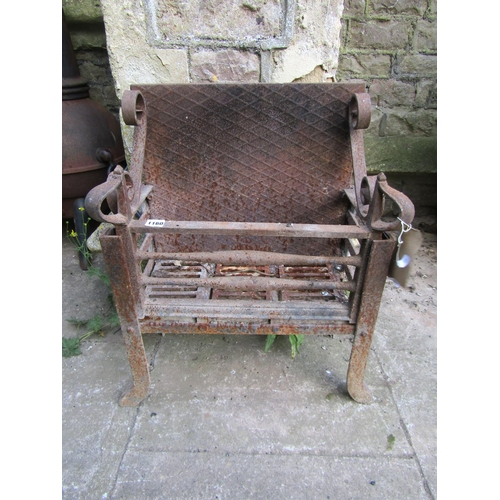 1194 - An old cast iron fire basket of rectangular form with open scroll detail and unusual sabre finials 6... 