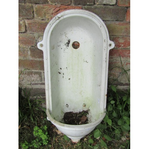 1217 - A cast iron and enamel niche font of arched form with bow fronted reservoir approx 70 cm high x 38 c... 