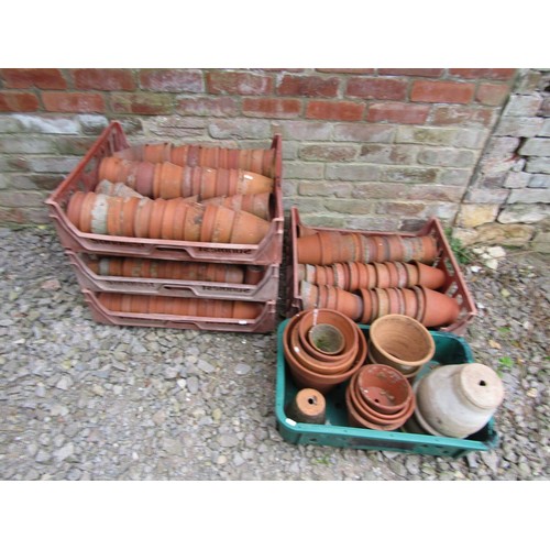 1223 - Approx 200 weathered terracotta flower pots of varying size, an average example 13 cm high x 14 cm d... 