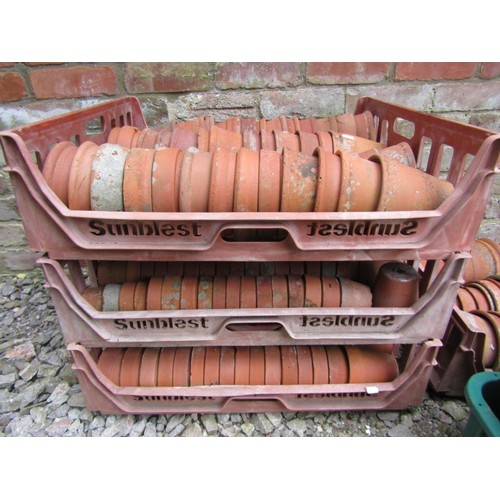 1223 - Approx 200 weathered terracotta flower pots of varying size, an average example 13 cm high x 14 cm d... 