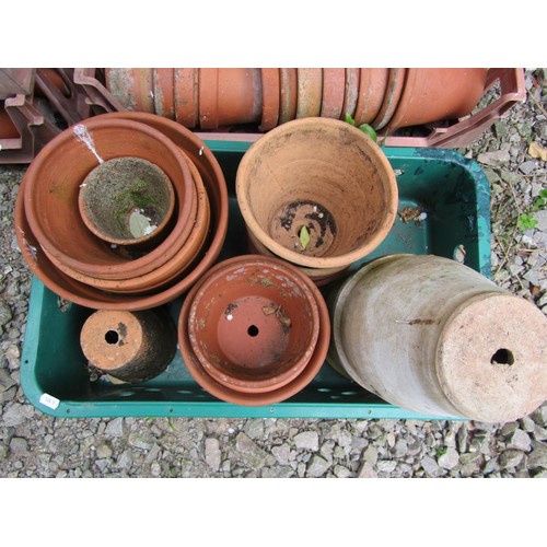 1223 - Approx 200 weathered terracotta flower pots of varying size, an average example 13 cm high x 14 cm d... 