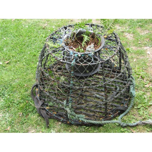 1230 - A lobster pot later adapted as a garden planter