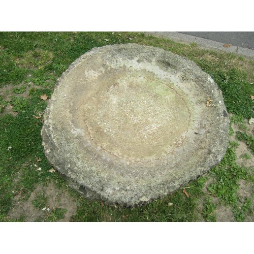 1238 - A weathered cast composition stone two sectional bird bath, the circular top with simulated bark boa... 