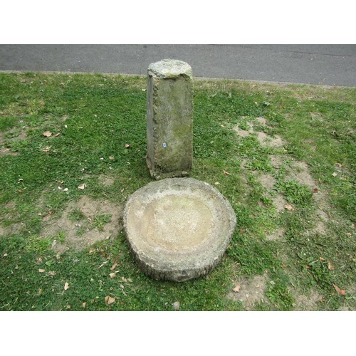 1238 - A weathered cast composition stone two sectional bird bath, the circular top with simulated bark boa... 