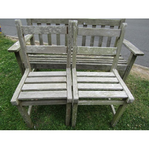 1245 - A vintage weathered teak two seat garden bench with slatted seat and back (probably a Lister example... 