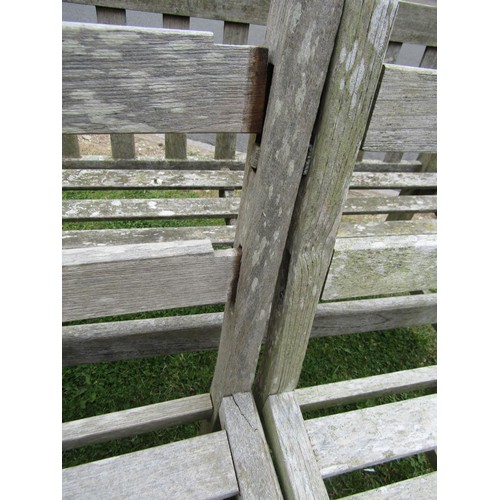 1245 - A vintage weathered teak two seat garden bench with slatted seat and back (probably a Lister example... 