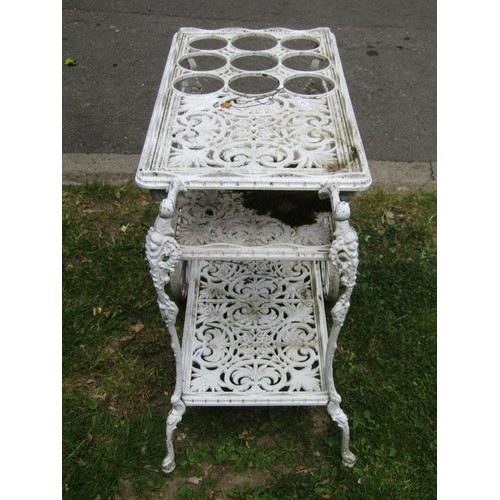 1246 - A decorative painted cast alloy, three tier, two wheeled drinks trolley/cart with decorative pierced... 