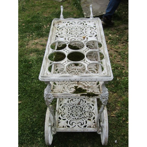 1246 - A decorative painted cast alloy, three tier, two wheeled drinks trolley/cart with decorative pierced... 