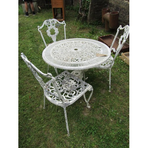 1247 - A painted and weathered cast aluminium garden terrace table of circular form with decorative pierced... 