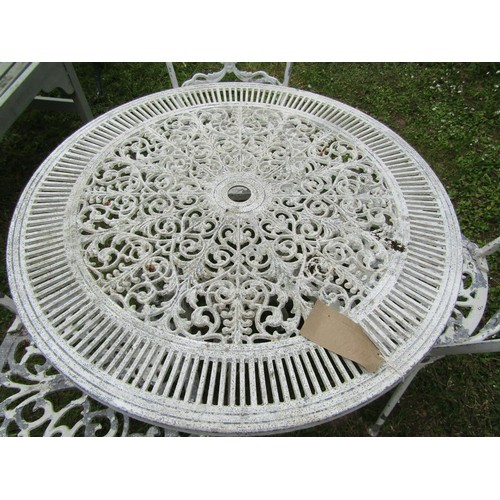 1247 - A painted and weathered cast aluminium garden terrace table of circular form with decorative pierced... 