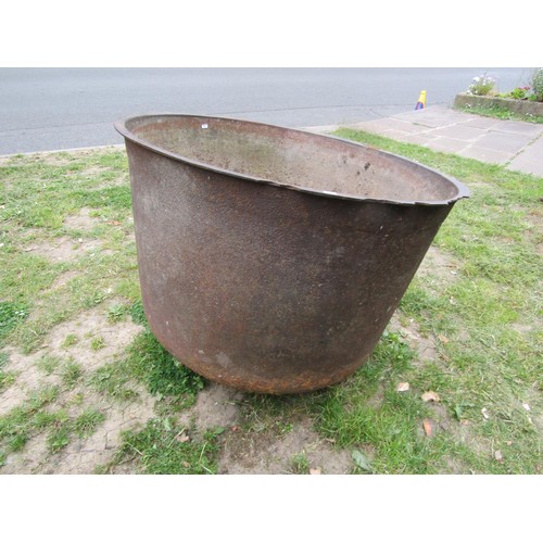 1268 - A large antique cast iron cauldron with simple flared rim, 70 cm high x 95 cm diameter (af)