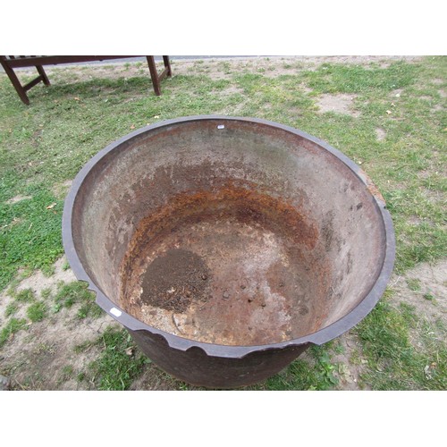 1268 - A large antique cast iron cauldron with simple flared rim, 70 cm high x 95 cm diameter (af)