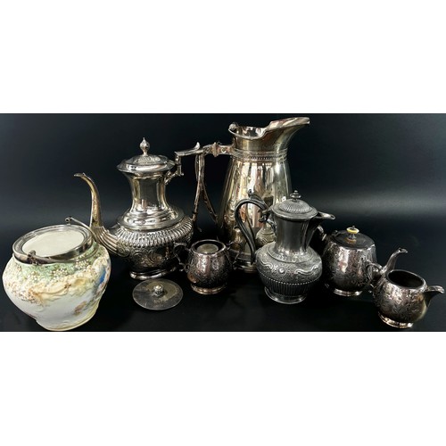 167 - A mixed collection of silver plated wares to include a good quality heavy ewer with foliate stamped ... 