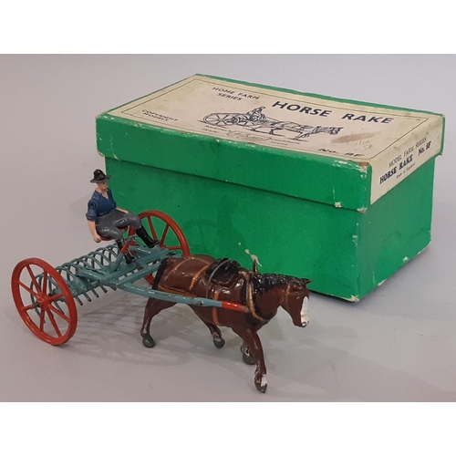 889 - A collection of Model Home Farm toys including boxed Horse Rake 8F, various unboxed animals, impleme... 