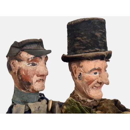 900 - Two Victorian character glove puppets both with carved wooden head and hands, and with painted featu... 