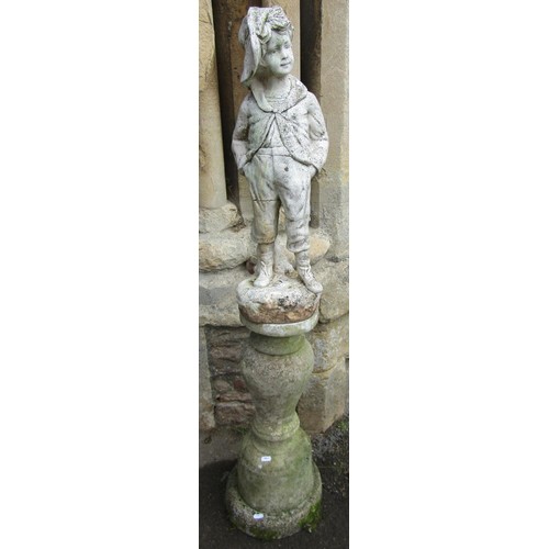 1271 - A cast composition stone garden ornament in the form of a country boy in standing pose raised on a l... 