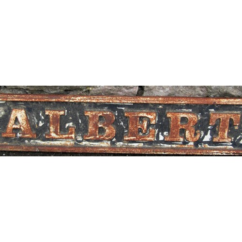 1284 - A weathered cast iron sign with raised lettering 'Albert Square' 14 cm x 109 cm