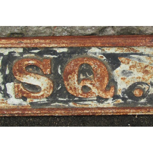 1284 - A weathered cast iron sign with raised lettering 'Albert Square' 14 cm x 109 cm