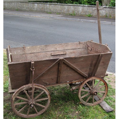 1264 - An old agricultural hand cart with boarded wooden body, chamfered spoke wheels, iron rims and fittin... 