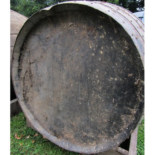 1263 - A large coopered oak and steel banded barrel adapted as a dog kennel, the barrel dimensions 123 cm (... 