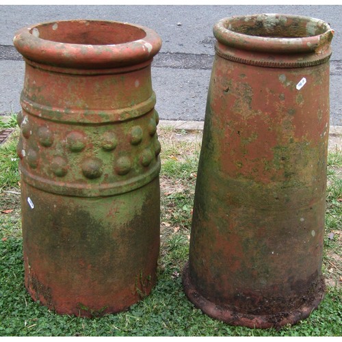 1210 - A weathered terracotta chimney/forcing pot of cylindrical tapering form 63 cm high together with a f... 