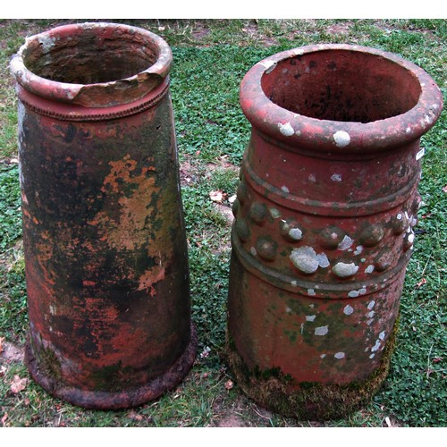 1210 - A weathered terracotta chimney/forcing pot of cylindrical tapering form 63 cm high together with a f... 