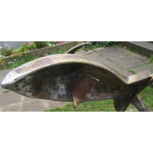 1261 - A weathered contemporary garden water feature in the form of leaping fish set in a hag stone and sim... 