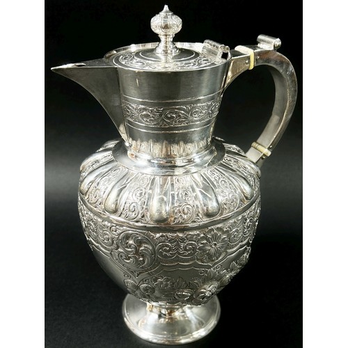 195 - An Edwardian silver wine jug designed with scrolled vines, fruits and flowers, Sheffield, 1903, make... 