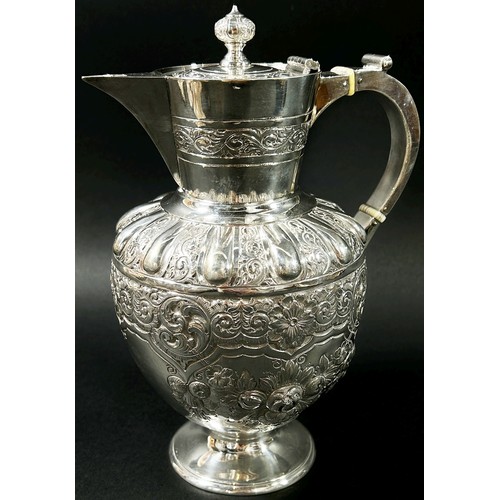 195 - An Edwardian silver wine jug designed with scrolled vines, fruits and flowers, Sheffield, 1903, make... 