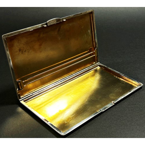 201 - A silver engine turned cigarette case with gilded interior, Birmingham, 1946, makers mark William Su... 