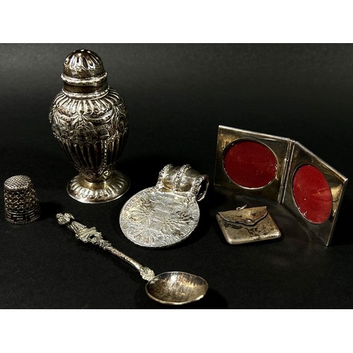 206 - A small group of silver object d'art to include an Austrian Thaler coin pendant and a miniature fold... 