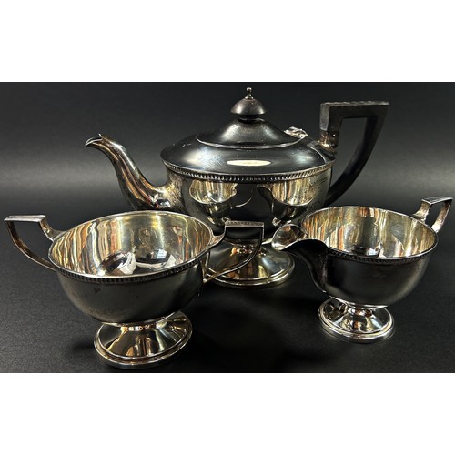 210 - A solid silver tea service to include its tea pot, milk jug and sugar bowl, Sheffield, 1930, makers ... 