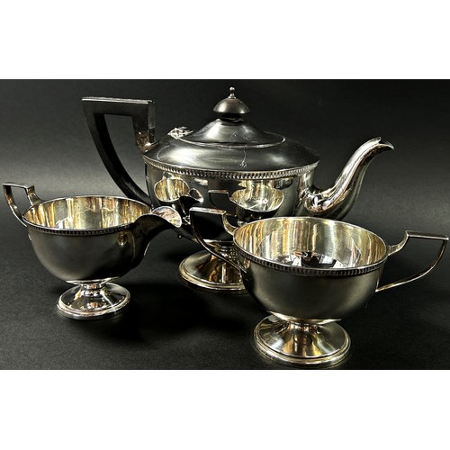 210 - A solid silver tea service to include its tea pot, milk jug and sugar bowl, Sheffield, 1930, makers ... 