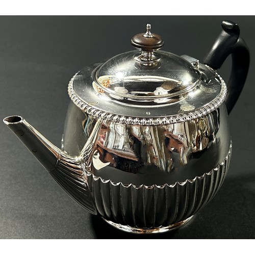 212 - A small half fluted designed tea pot, hallmarks rubbed, London, 1889, 9.1oz all in